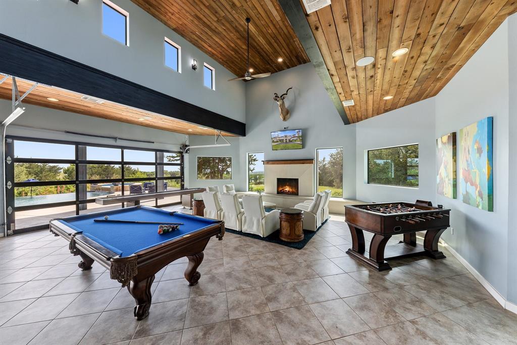 124 Private Road 2202 Decatur, TX 76234 - Photo 30 of 40 a living room with furniture a table tennis pool table and chairs