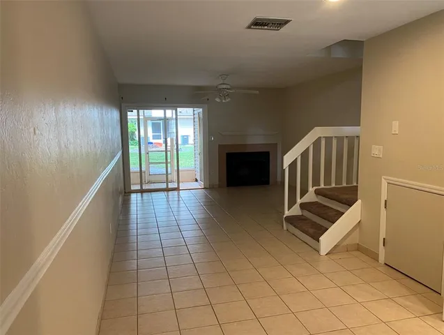 a view of kitchen with furniture and a window