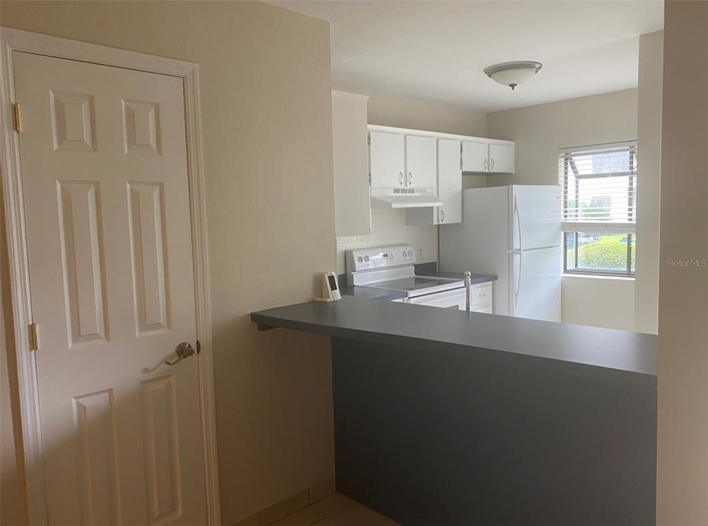 6138 Southwest 8th Lane Gainesville, FL 32607 - Photo 8 of 9 a kitchen with a sink a window and cabinets