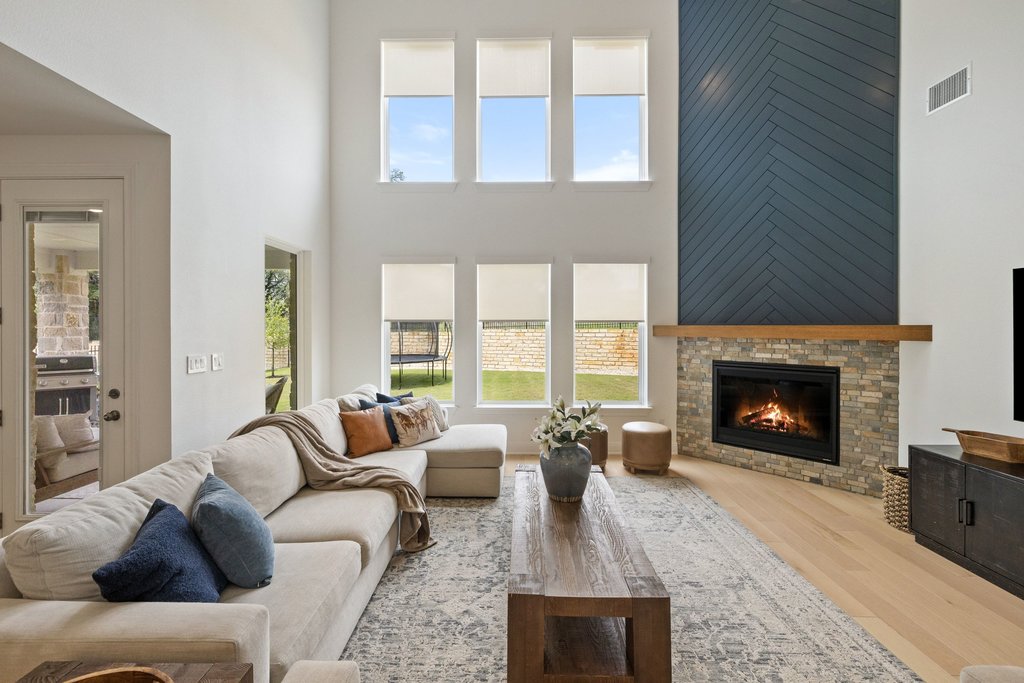 365 Pear Tree Lane Austin, TX 78737 - Photo 11 of 39 a living room with furniture and a fireplace