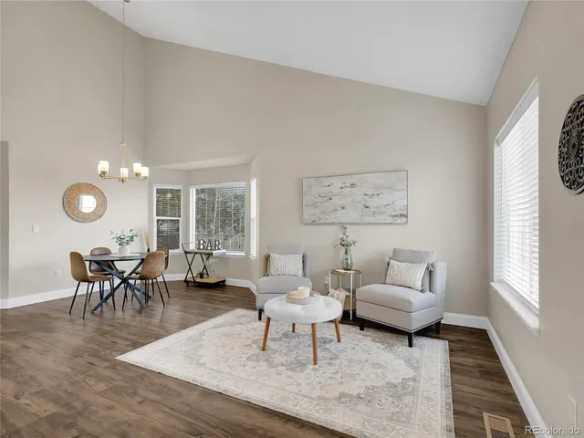 a living room with furniture and a rug