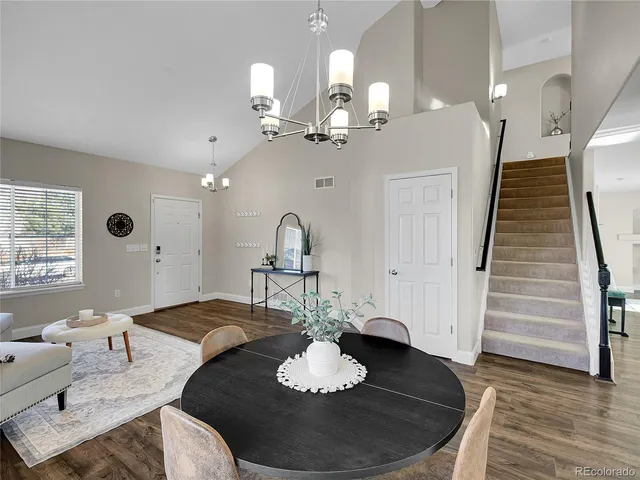 a living room with furniture flowerpot and a window