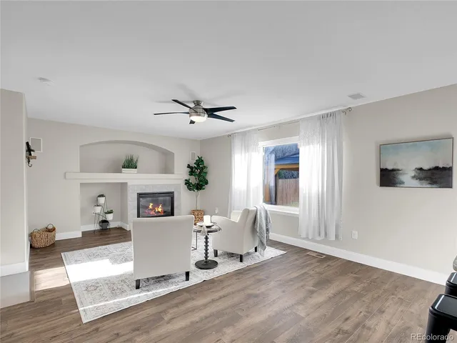 a living room with furniture and a window