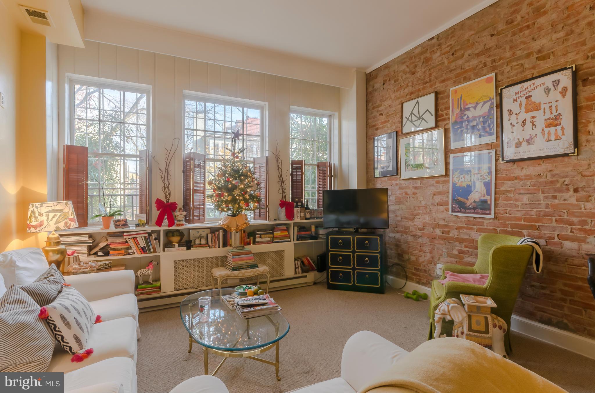 10 7th Street Northeast Washington, DC 20002 - Photo 3 of 30 a living room with furniture fireplace and a large window
