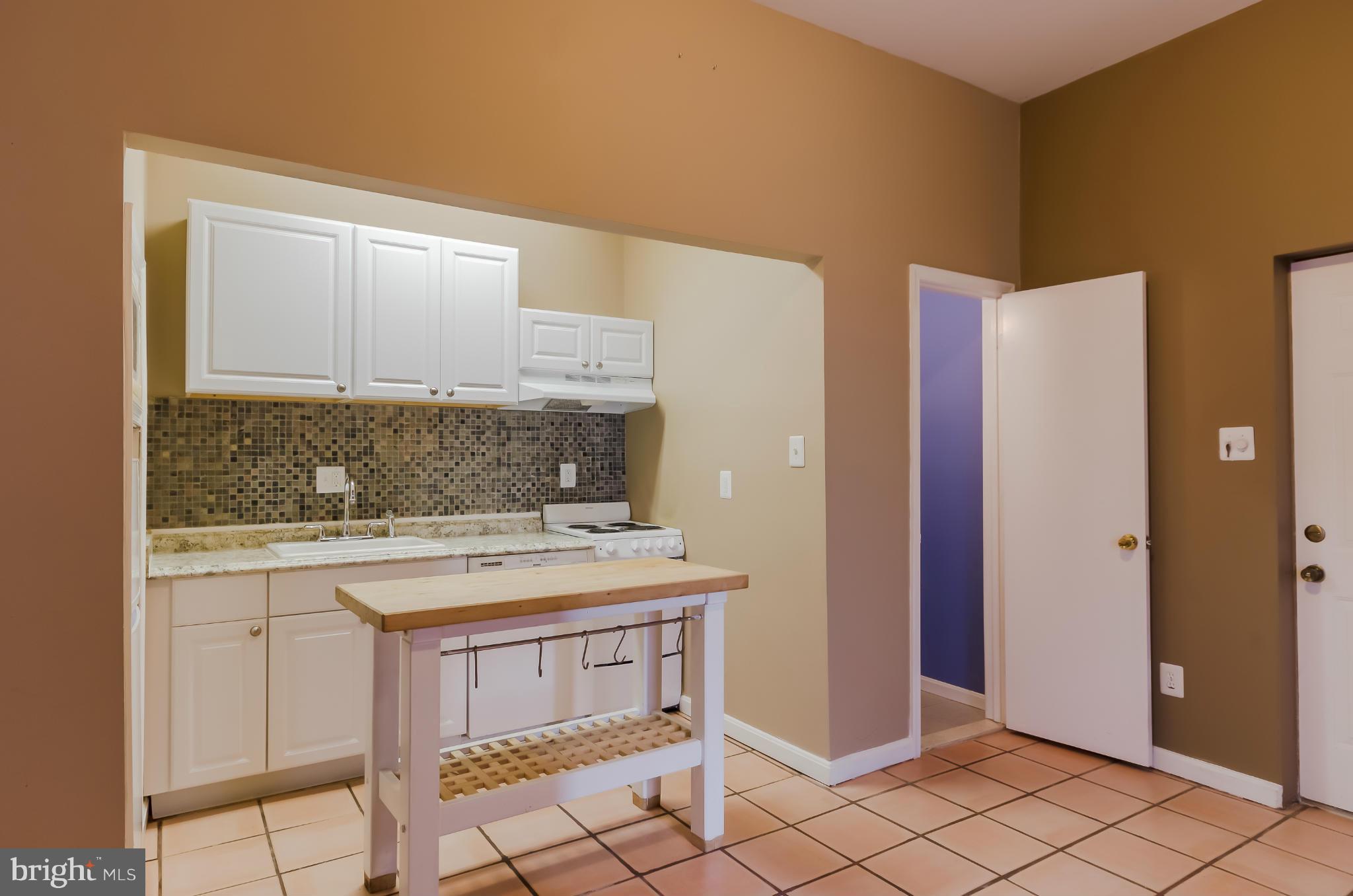 10 7th Street Northeast Washington, DC 20002 - Photo 23 of 30 a kitchen with a sink cabinets and wooden floor