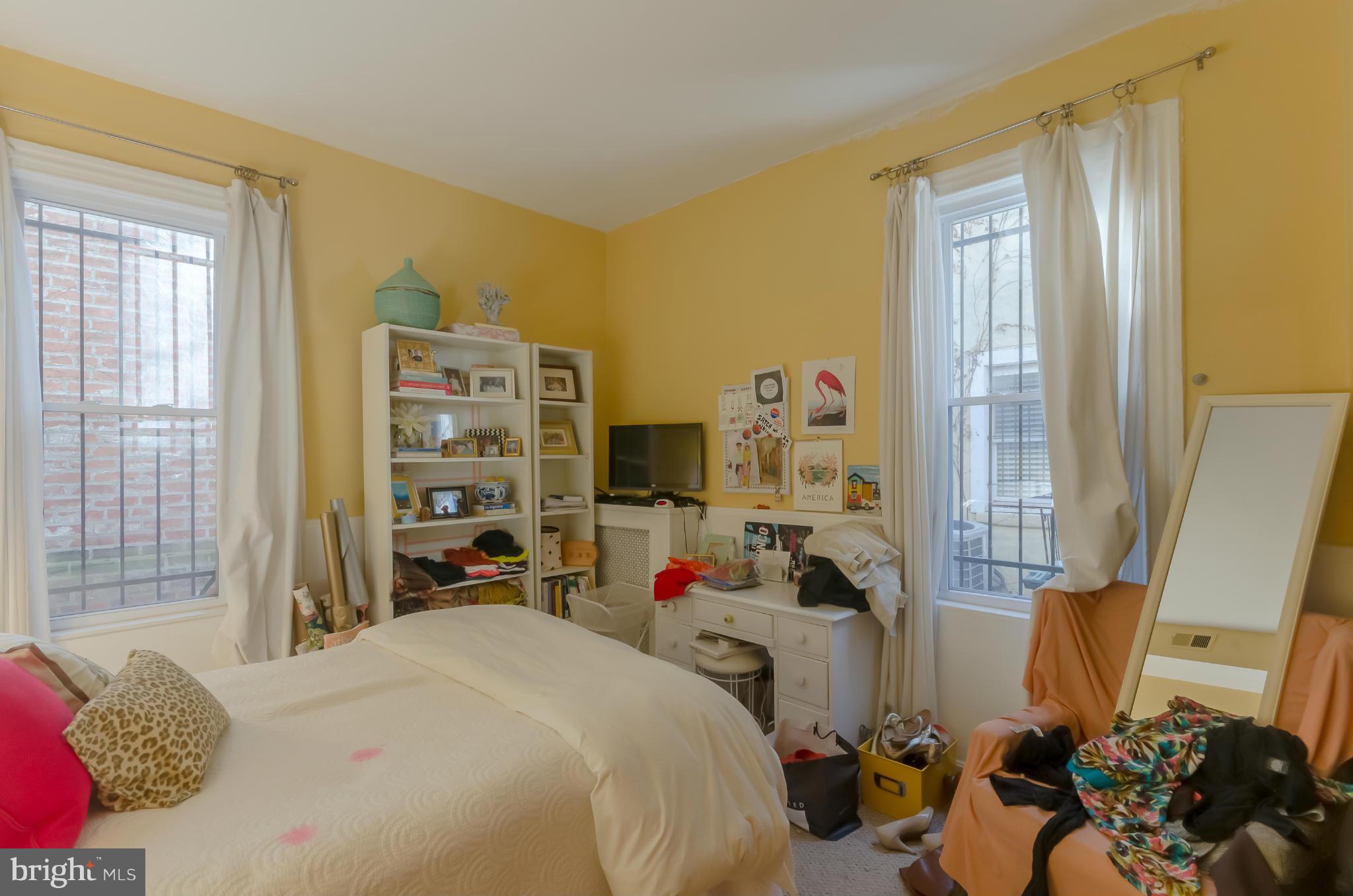 10 7th Street Northeast Washington, DC 20002 - Photo 6 of 30 a bedroom that has a bed and a chair