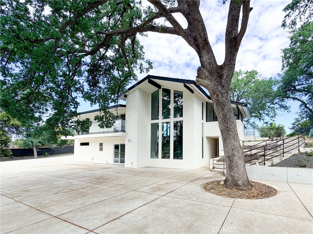374 Stilson Canyon Road Chico, CA 95928 - Photo 1 of 37 a front view of a house with a tree