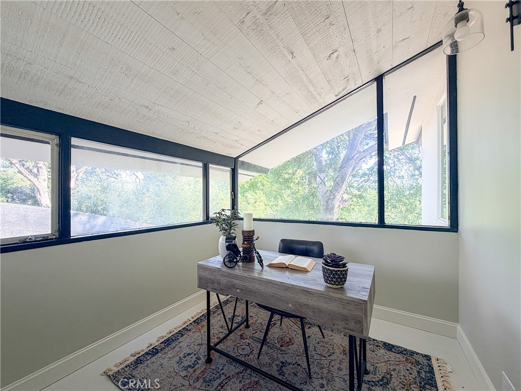 374 Stilson Canyon Road Chico, CA 95928 - Photo 11 of 37 a view of a workspace with furniture and window