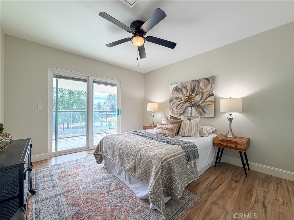 374 Stilson Canyon Road Chico, CA 95928 - Photo 12 of 37 a bedroom with a bed and a large window