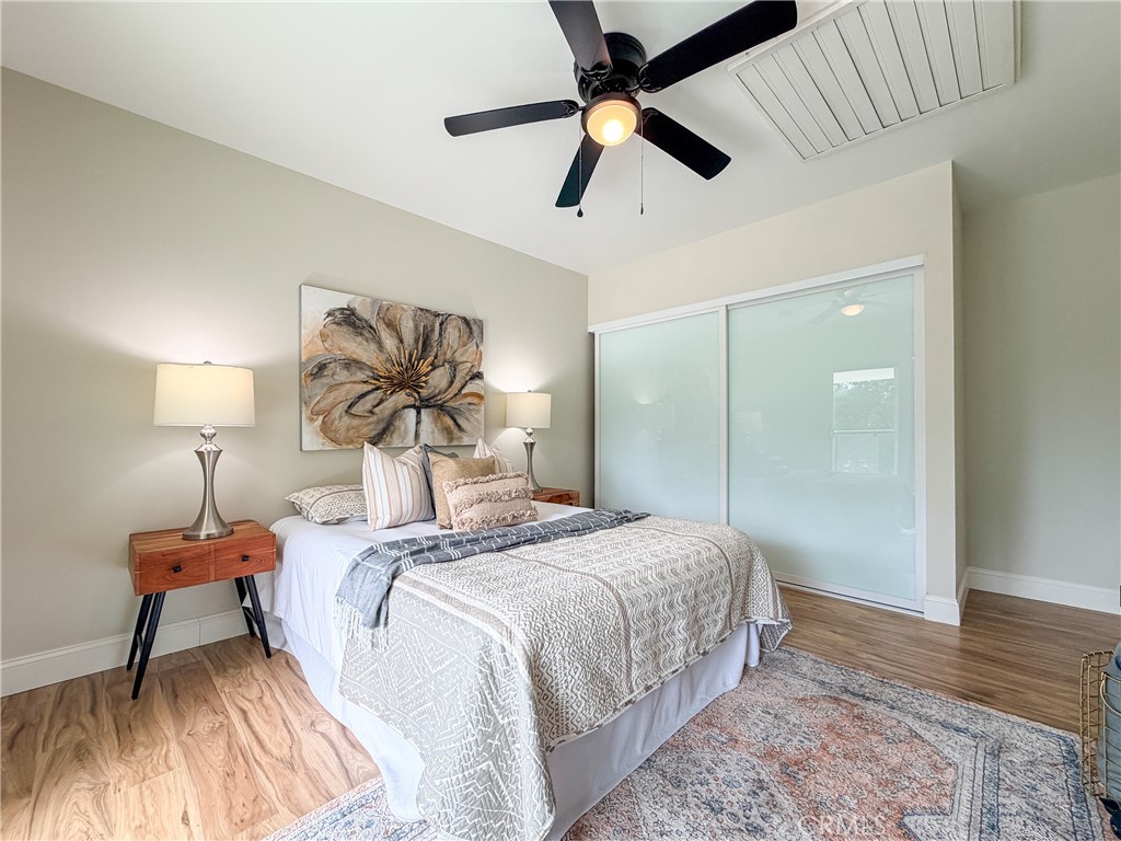374 Stilson Canyon Road Chico, CA 95928 - Photo 13 of 37 a bedroom with a bed and a chandelier