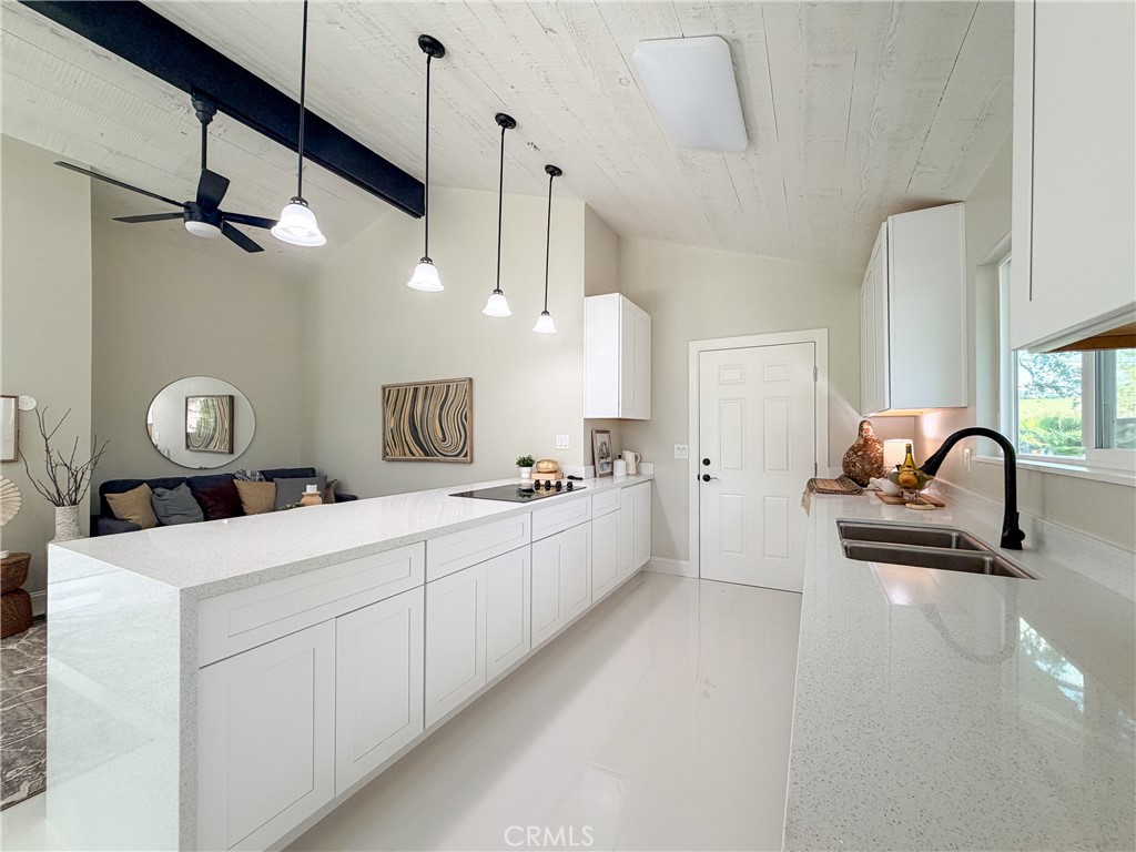 374 Stilson Canyon Road Chico, CA 95928 - Photo 8 of 37 a kitchen with sink and white cabinets