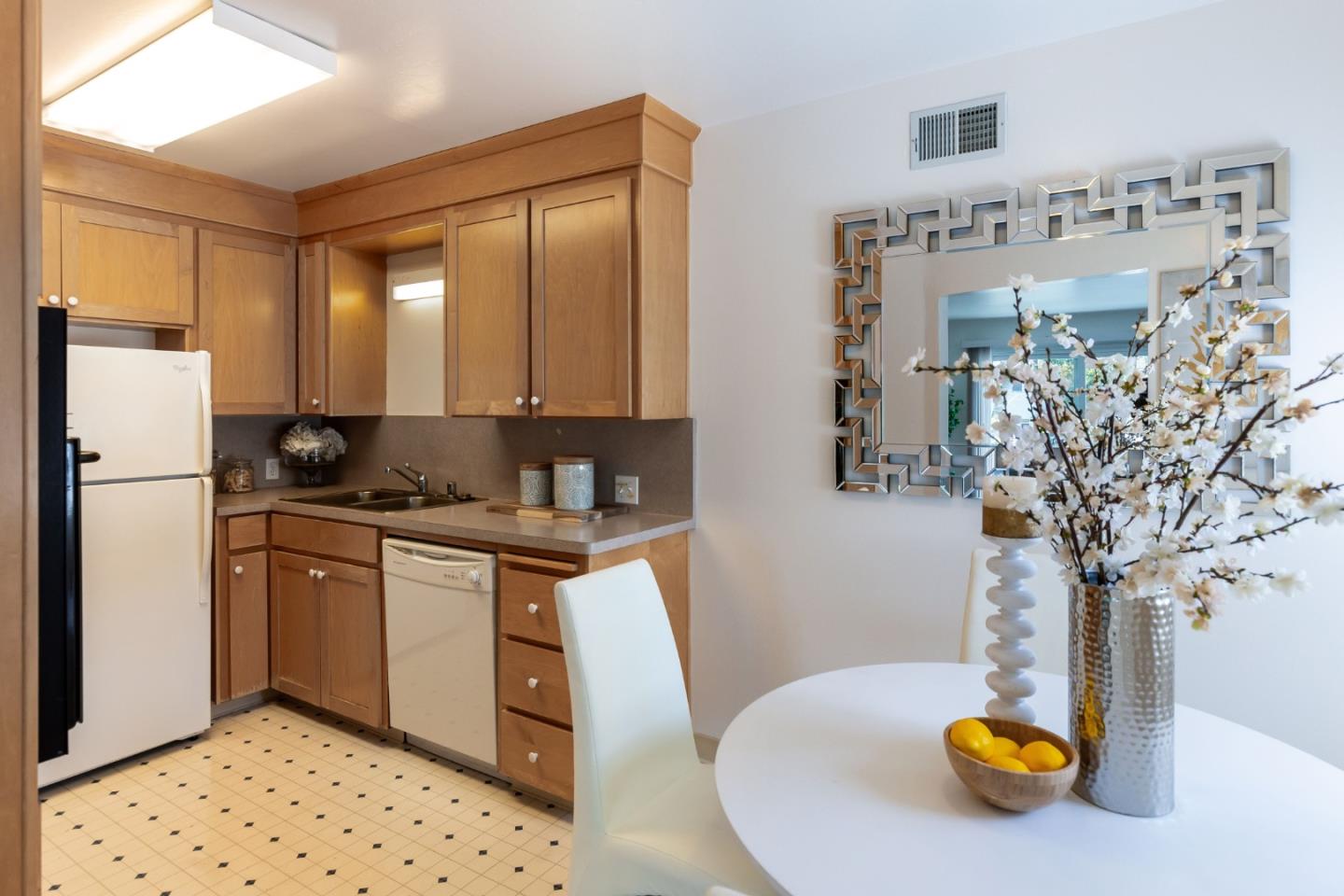 759 Middlefield Road Palo Alto, CA 94301 - Photo 11 of 35 a kitchen with stainless steel appliances granite countertop a refrigerator a stove and white cabinets