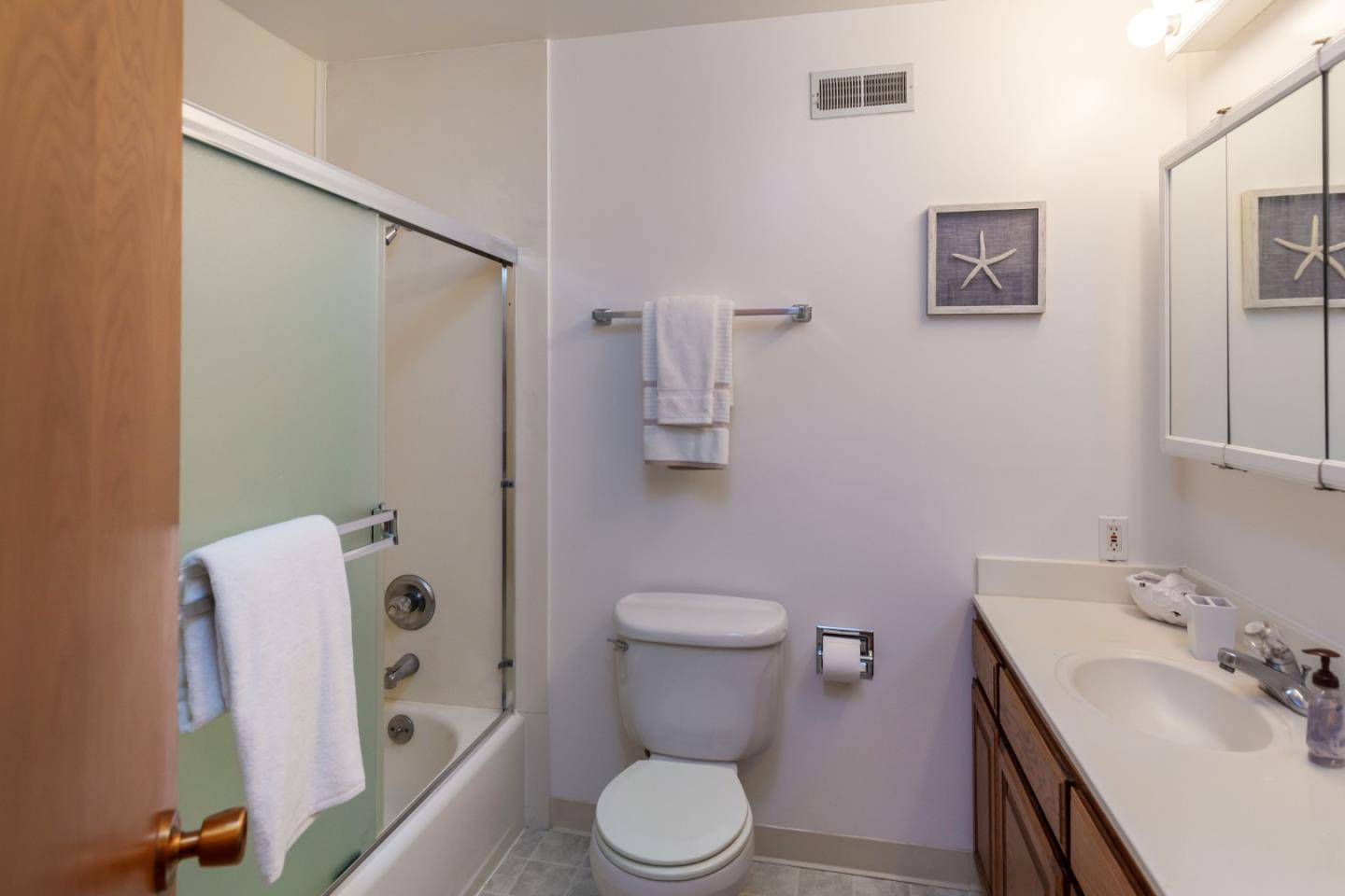 759 Middlefield Road Palo Alto, CA 94301 - Photo 12 of 35 a bathroom with a toilet sink and mirror