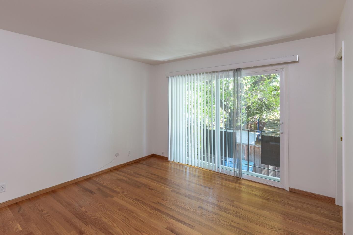 759 Middlefield Road Palo Alto, CA 94301 - Photo 17 of 35 a view of an empty room with wooden floor and a window