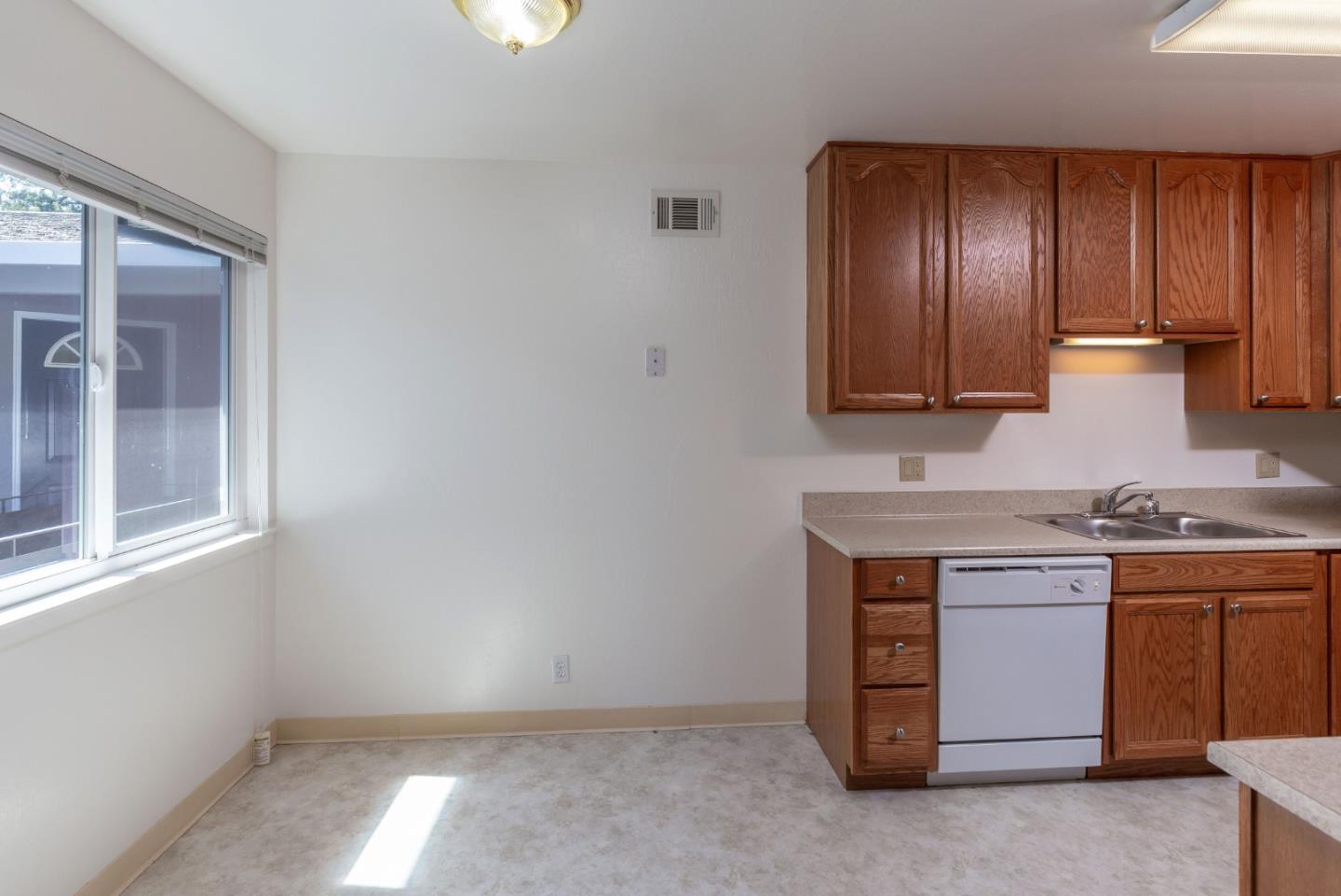 759 Middlefield Road Palo Alto, CA 94301 - Photo 18 of 35 a view of cabinets with stainless steel appliances granite countertop cabinets and a window