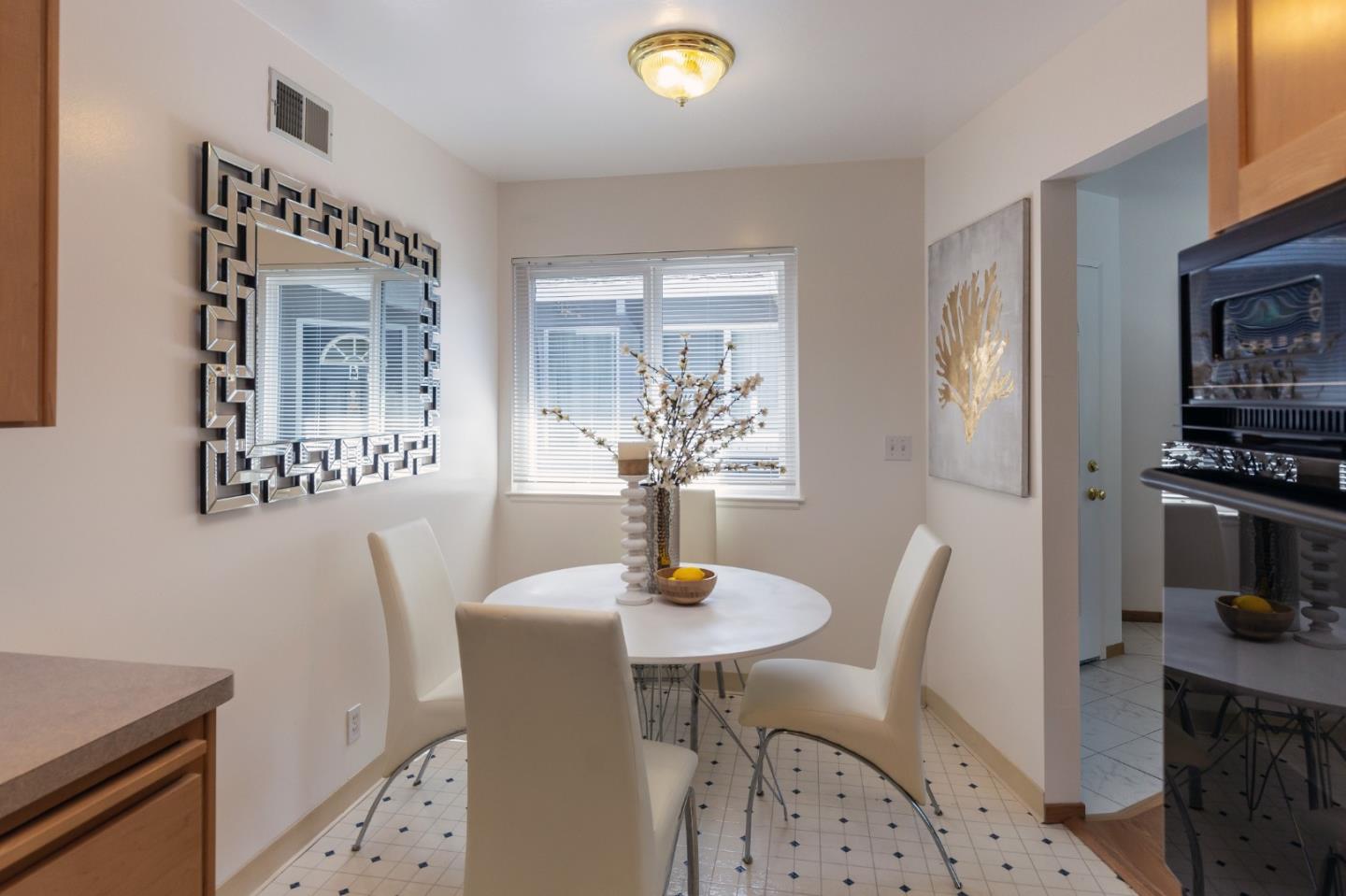 759 Middlefield Road Palo Alto, CA 94301 - Photo 9 of 35 a view of a dining room with furniture and wooden floor