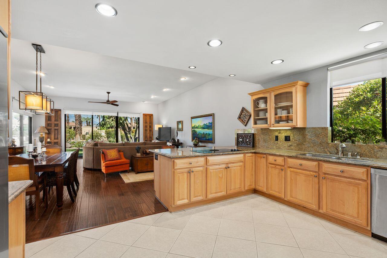 45475 Pueblo Road Indian Wells, CA 92210 - Photo 11 of 30 a large kitchen with lots of counter and chairs