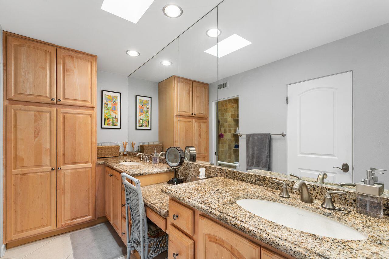 45475 Pueblo Road Indian Wells, CA 92210 - Photo 15 of 30 a bathroom with a granite countertop sink and a mirror