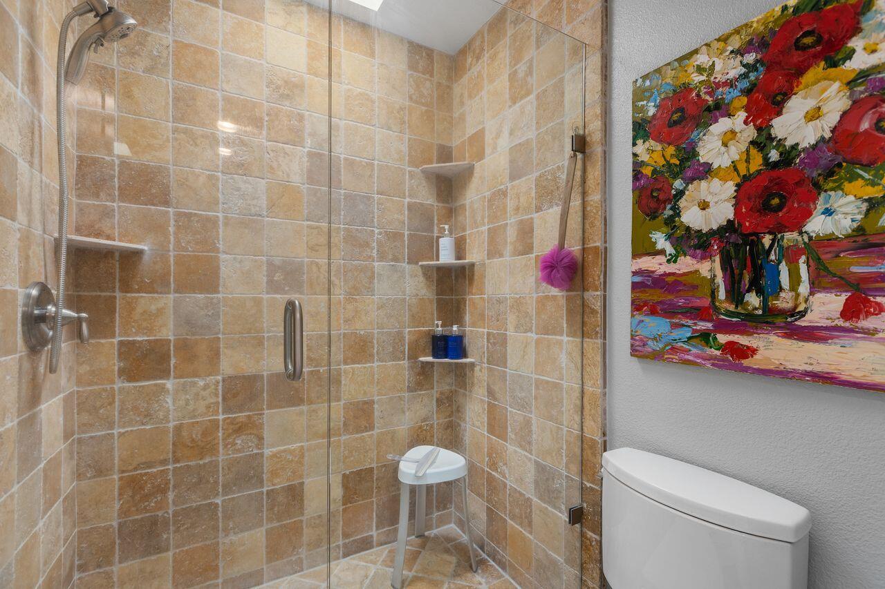 45475 Pueblo Road Indian Wells, CA 92210 - Photo 16 of 30 a bathroom with a toilet and a shower curtain