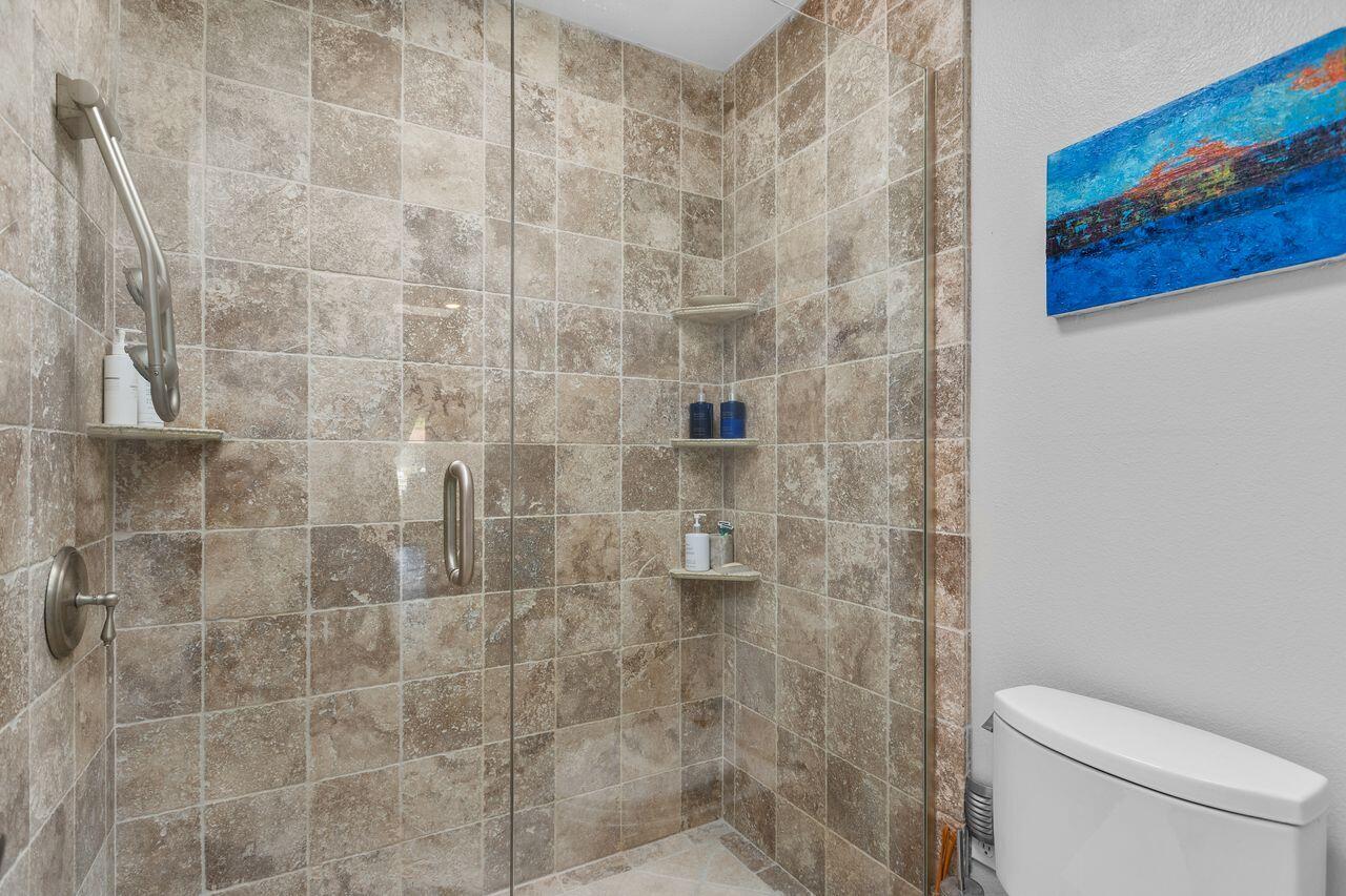 45475 Pueblo Road Indian Wells, CA 92210 - Photo 20 of 30 a bathroom with a toilet and a shower
