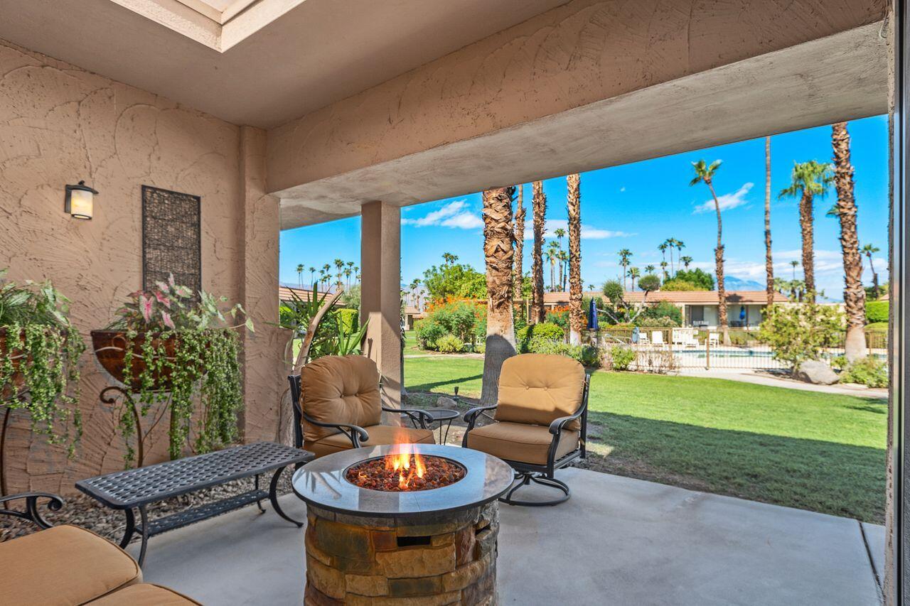 45475 Pueblo Road Indian Wells, CA 92210 - Photo 2 of 30 a outdoor living space with furniture and garden view