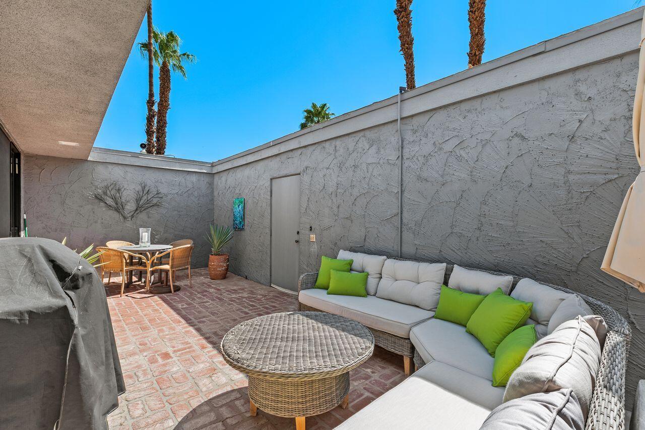 45475 Pueblo Road Indian Wells, CA 92210 - Photo 23 of 30 a backyard of a house with outdoor seating