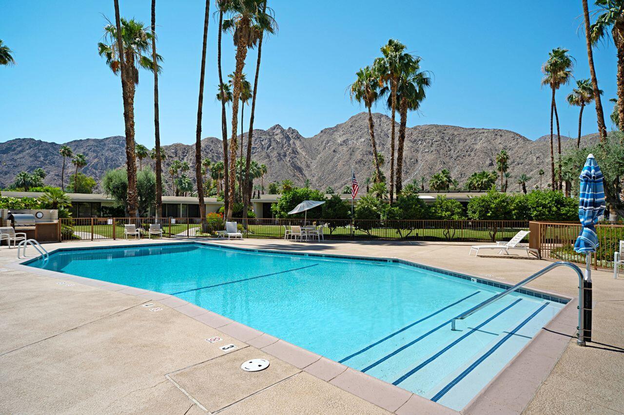 45475 Pueblo Road Indian Wells, CA 92210 - Photo 27 of 30 a view of swimming pool with a table and chairs