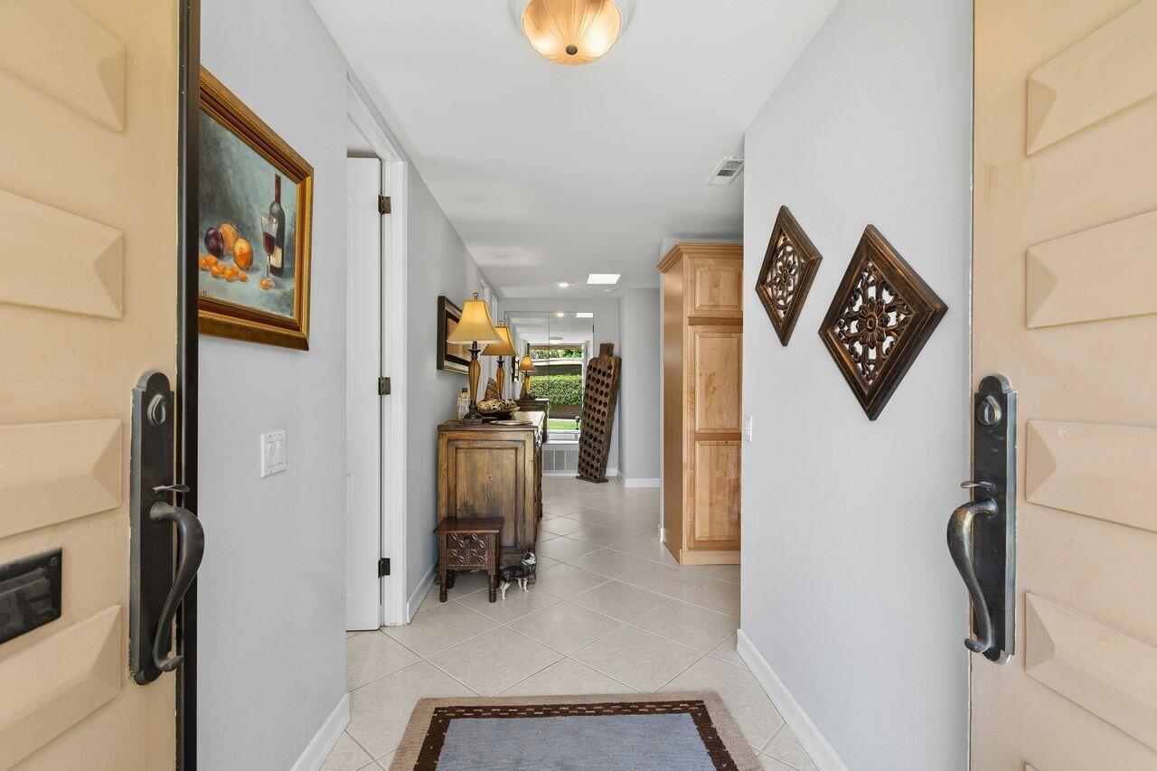 45475 Pueblo Road Indian Wells, CA 92210 - Photo 7 of 30 a view of a hallway with painted walls
