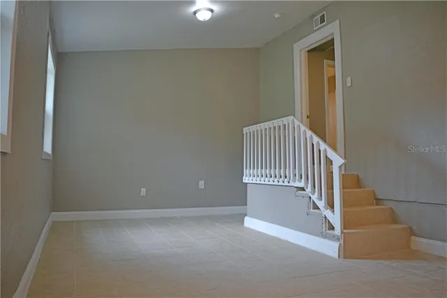 a view of a livingroom with a chandelier fan
