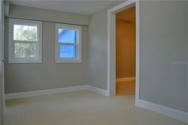 an empty room with windows