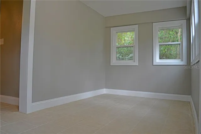 a view of a sink and a microwave in a kitchen