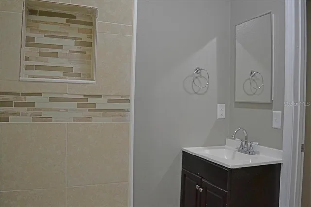 a view of an empty room with a window