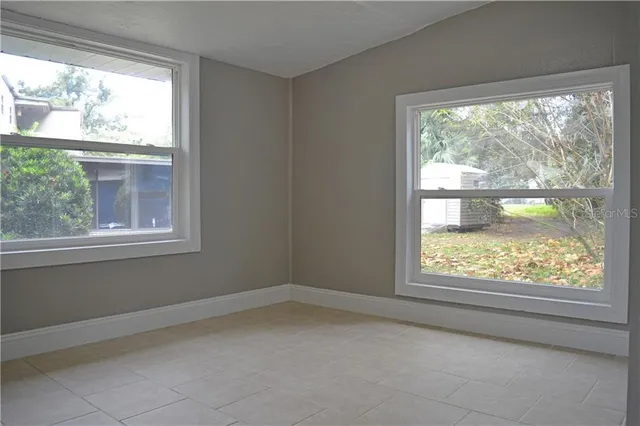 an empty room that has a window