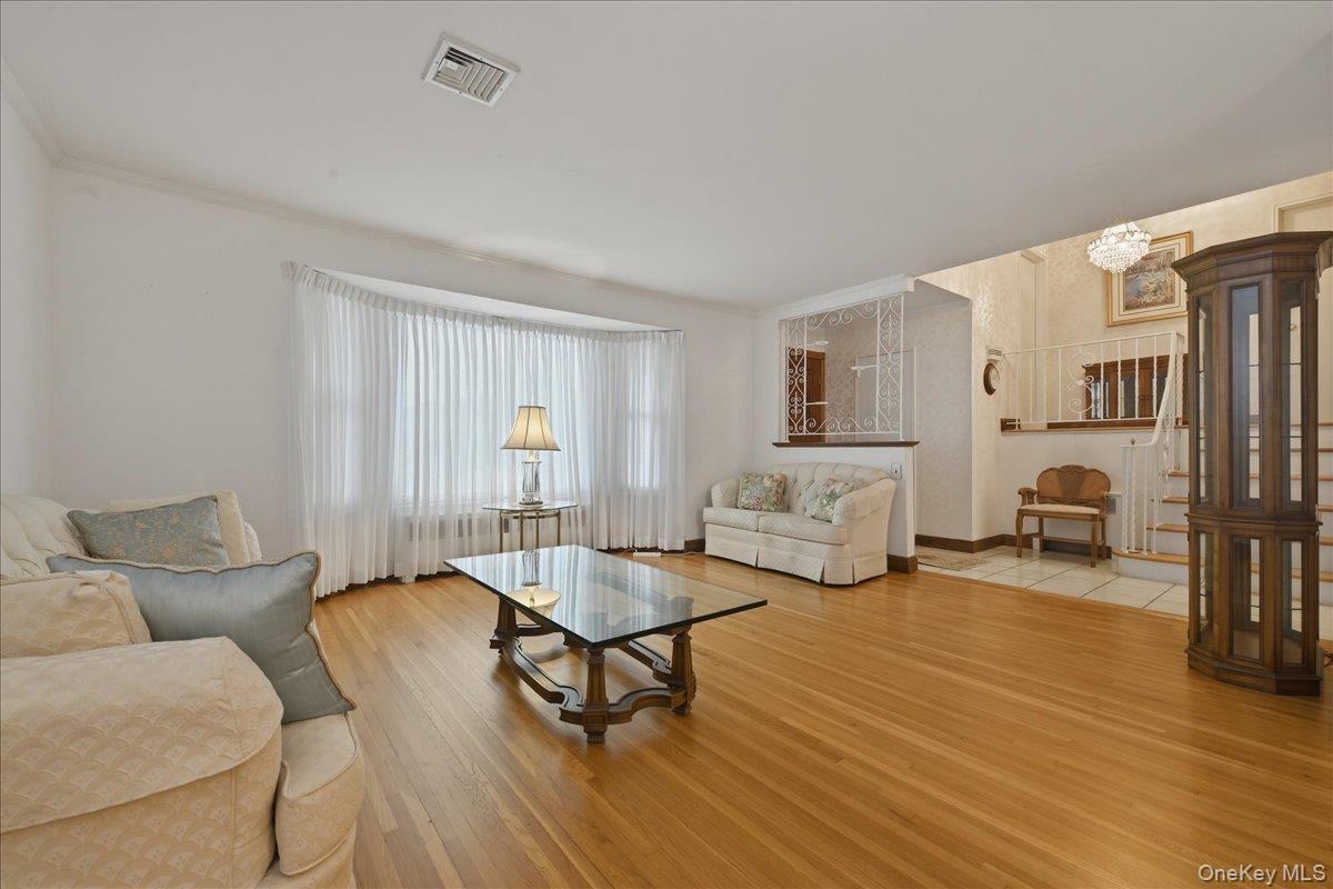17 Avon Road Farmingdale, NY 11735 - Photo 5 of 46 a living room with furniture and a table