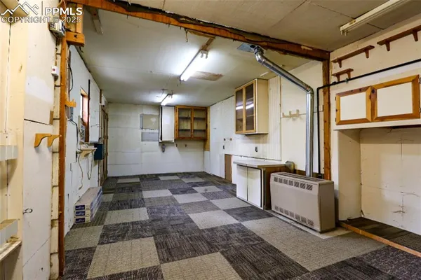 a kitchen with stainless steel appliances granite countertop a refrigerator and a stove
