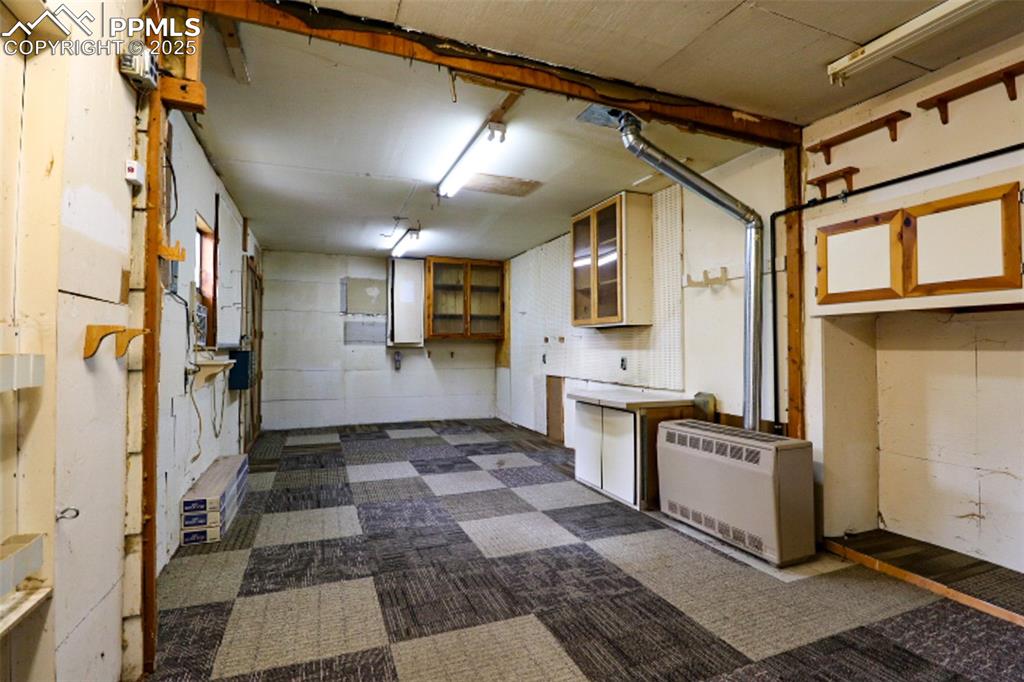 1206 Hartford Street Colorado Springs, CO 80906 - Photo 22 of 24 a kitchen with stainless steel appliances granite countertop a refrigerator and a stove