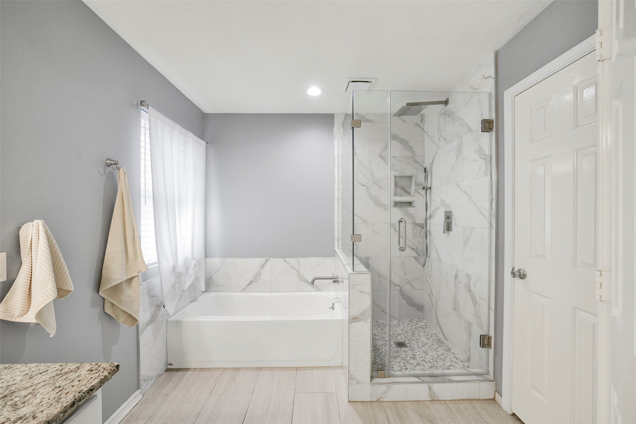 38 Tallow Hill Place Spring, TX 77382 - Photo 25 of 50 a bathroom with a tub shower and a sink