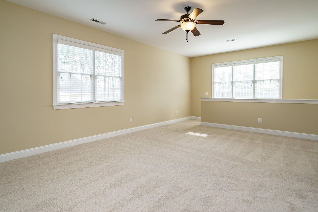 5327 Landguard Drive Raleigh, NC 27613 - Photo 33 of 45 Huge bonus room with closet, built in shelving and desk---perfect for home office or lots of play! Bonus Room