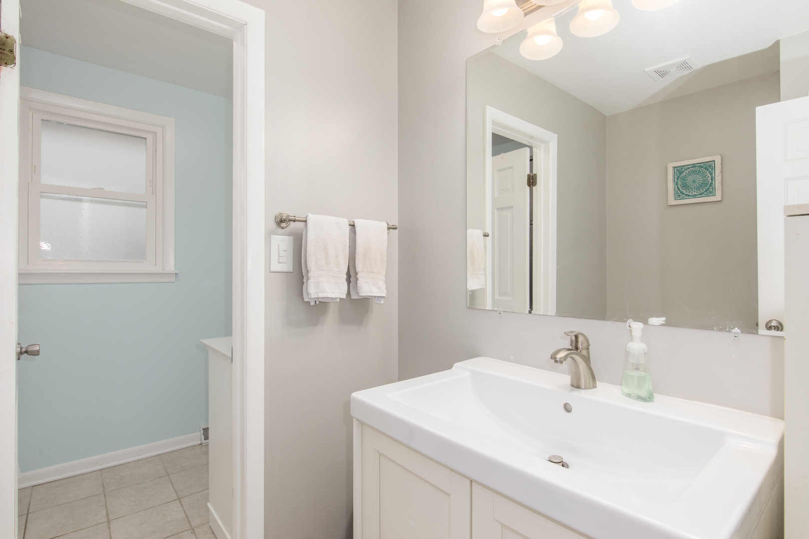 2005 Cayuga Lane Mount Prospect, IL 60056 - Photo 14 of 28 a bathroom with a sink a mirror and vanity