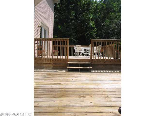 7293 Lee's Ridge Road Oak Ridge, NC 27310 - Photo 15 of 16 Patio/Deck. Two tiered deck offers plenty of space for outdoor living!