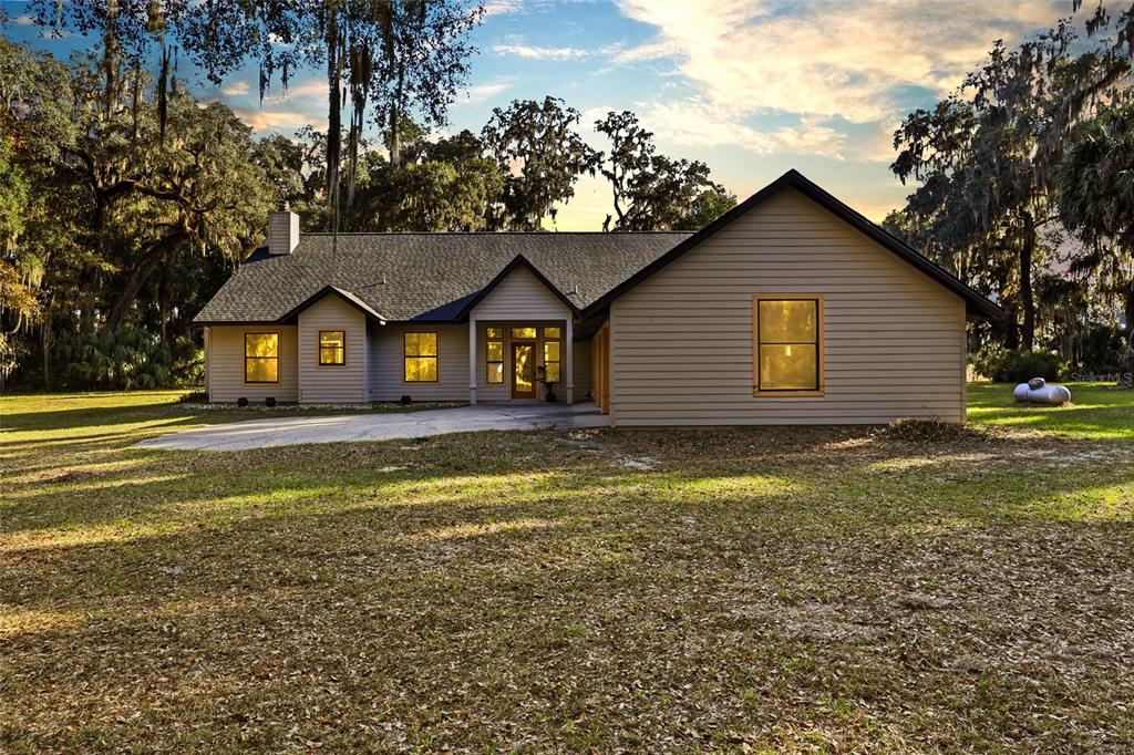 a view of house with outdoor space