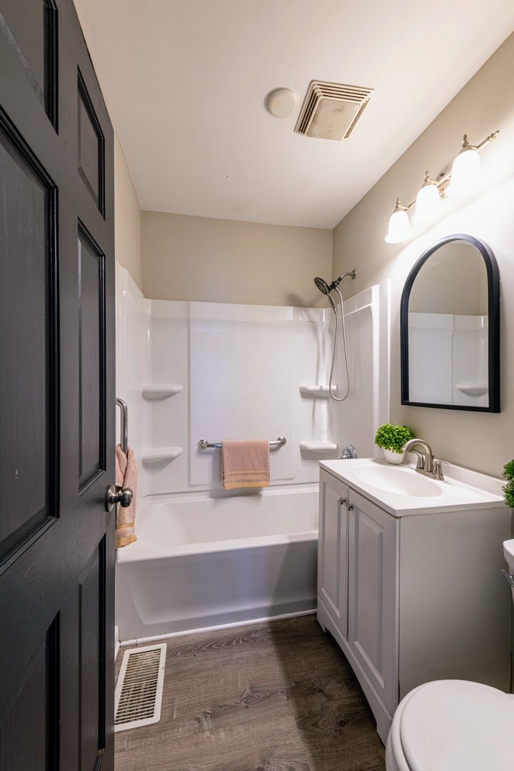3017 Gabriel Avenue Zion, IL 60099 - Photo 15 of 21 a bathroom with a sink vanity mirror and toilet