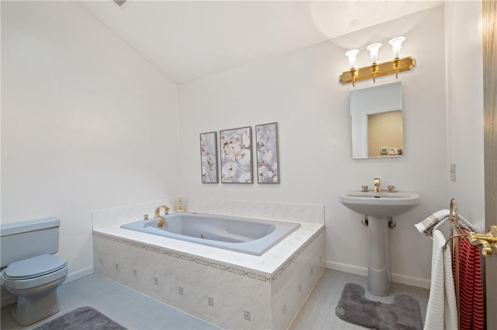 987 Beck Road Leechburg, PA 15656 - Photo 19 of 35 a bathroom with a sink a toilet and mirror