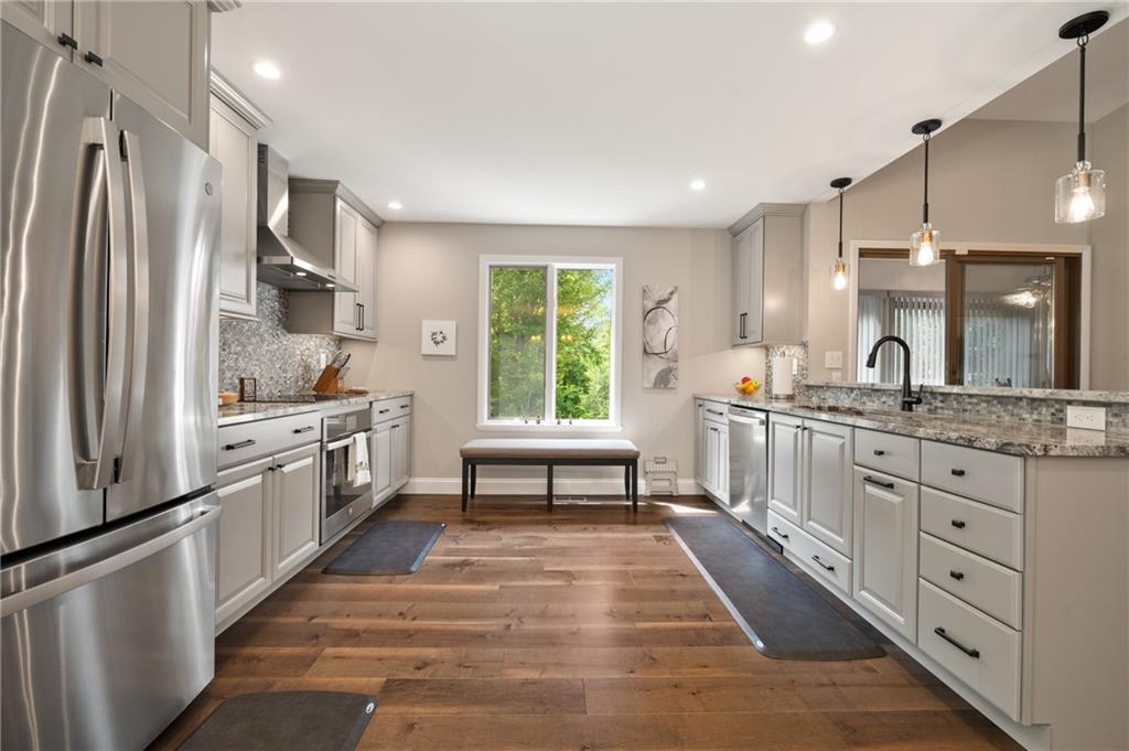 987 Beck Road Leechburg, PA 15656 - Photo 9 of 35 a kitchen with stainless steel appliances kitchen island granite countertop a refrigerator and a stove