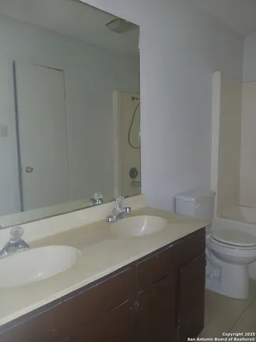 a bathroom with a sink and a toilet