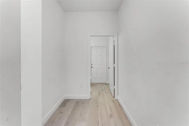 a view of a small space with wooden floor