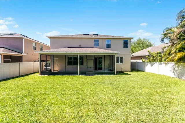 a view of a house with a garden and yard