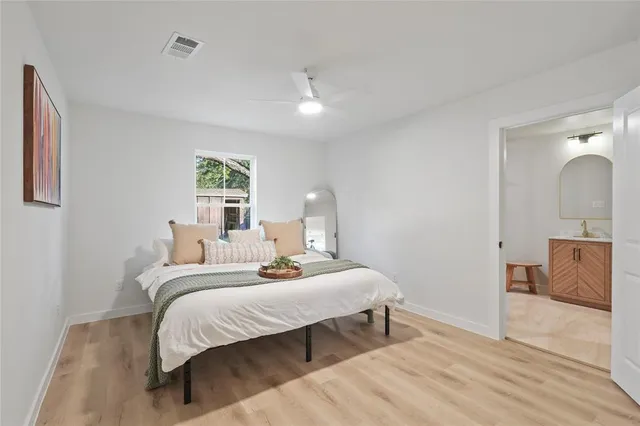 a bedroom with a bed and a couch