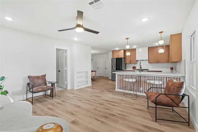 a view of kitchen with furniture and wooden floor