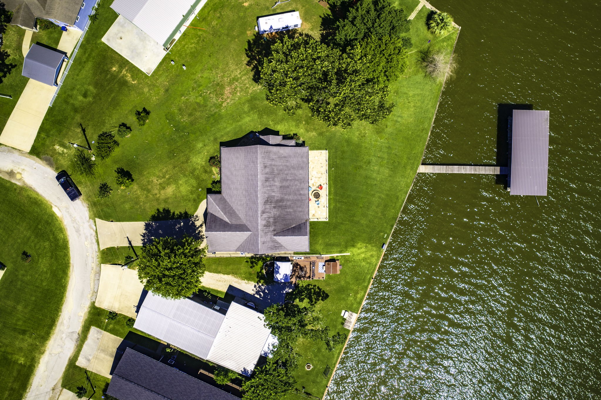 151 Key Largo Loop Point Blank, TX 77364 - Photo 42 of 49 Aerial view showcases the spacious front lot, private dock, and stunning open water views.